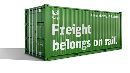 Green container with the label "Freight belongs on rail."